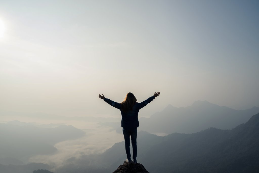 Young traveler standing and looking at beautiful landscape
