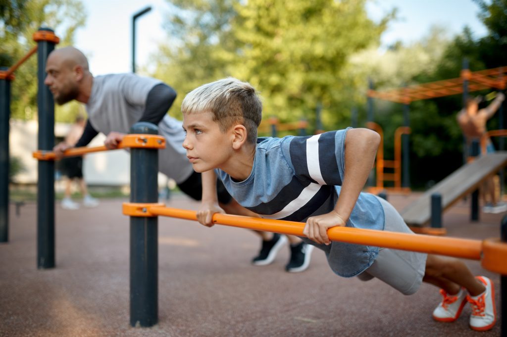 Father and child doing exercise, sport training