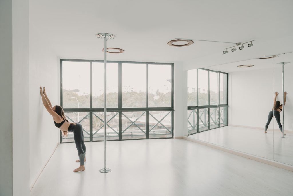 Flexible lady stretching in studio