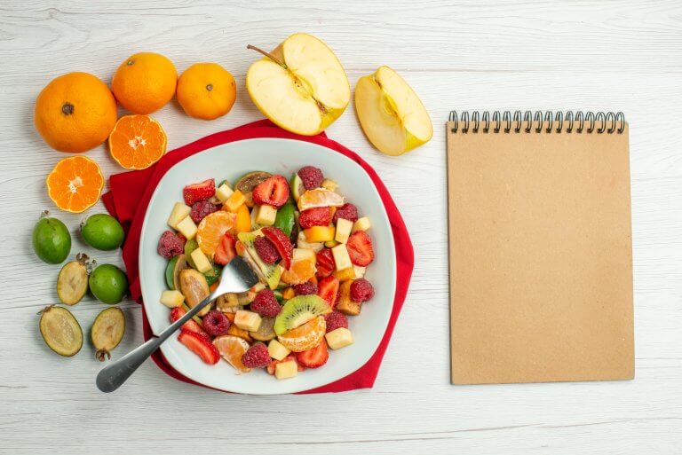 top view fresh fruit salad on white background mellow berry exotic photo fruity tropical