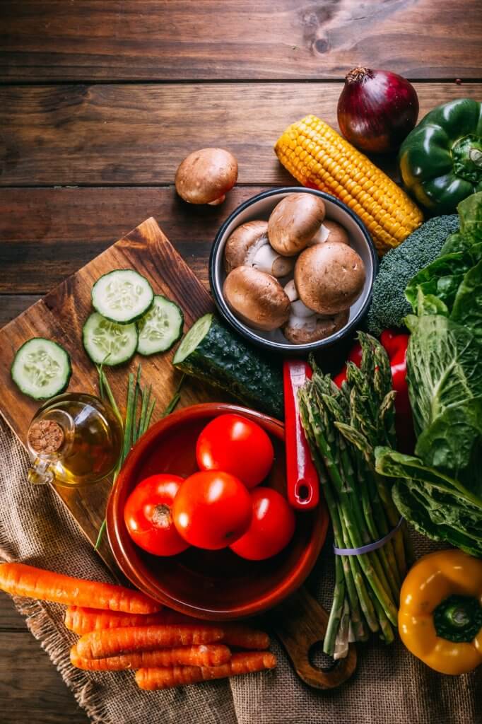 Vegetables and utensils on kitchen table