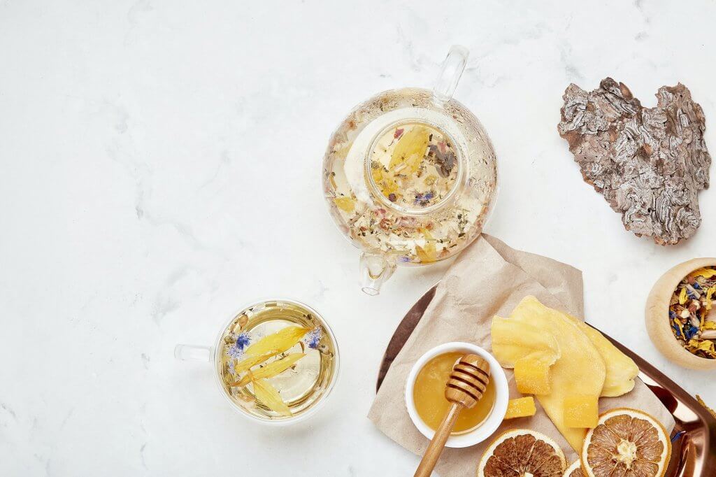 Alpine wellness elixir - holistic health in herbal cup background. Copy space