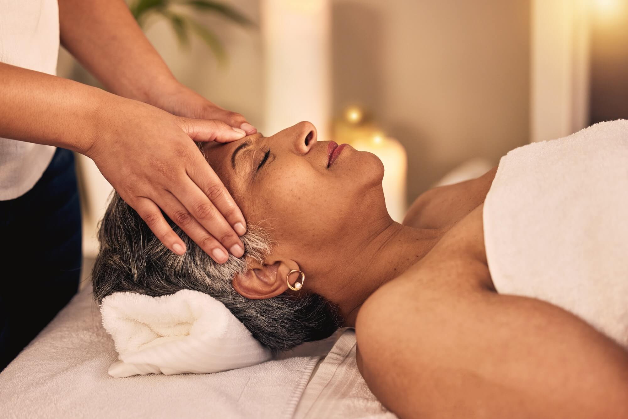 Woman, head massage and spa for beauty, skincare detox and healing zen therapy at cosmetic salon. F